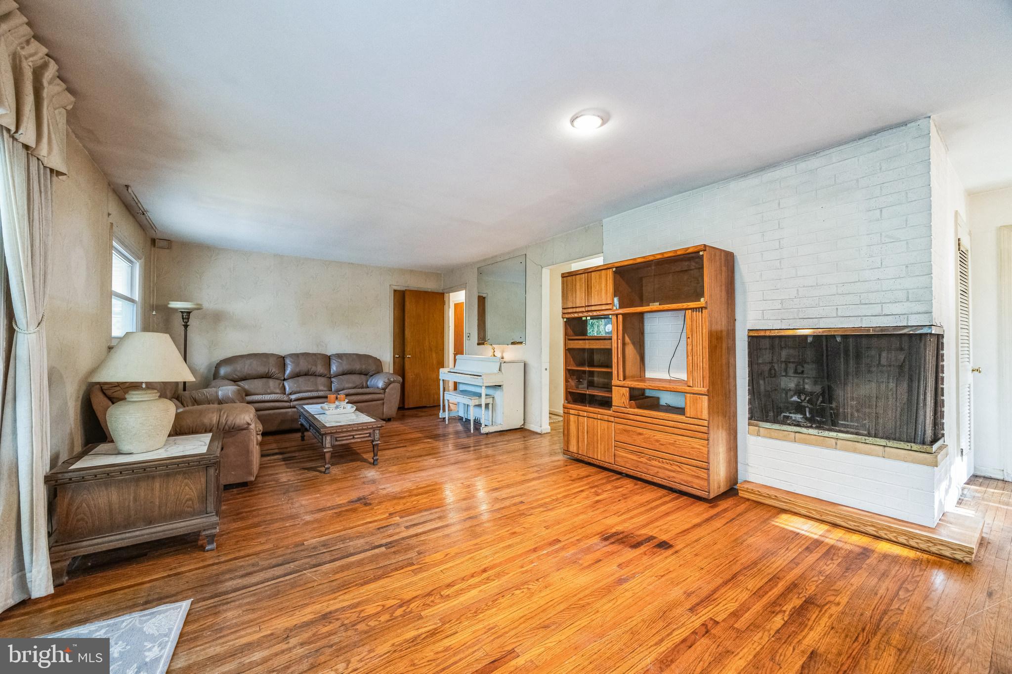 1246 Forge Road Cherry Hill, NJ 08034 - Photo 18 of 34 a living room with furniture and large window