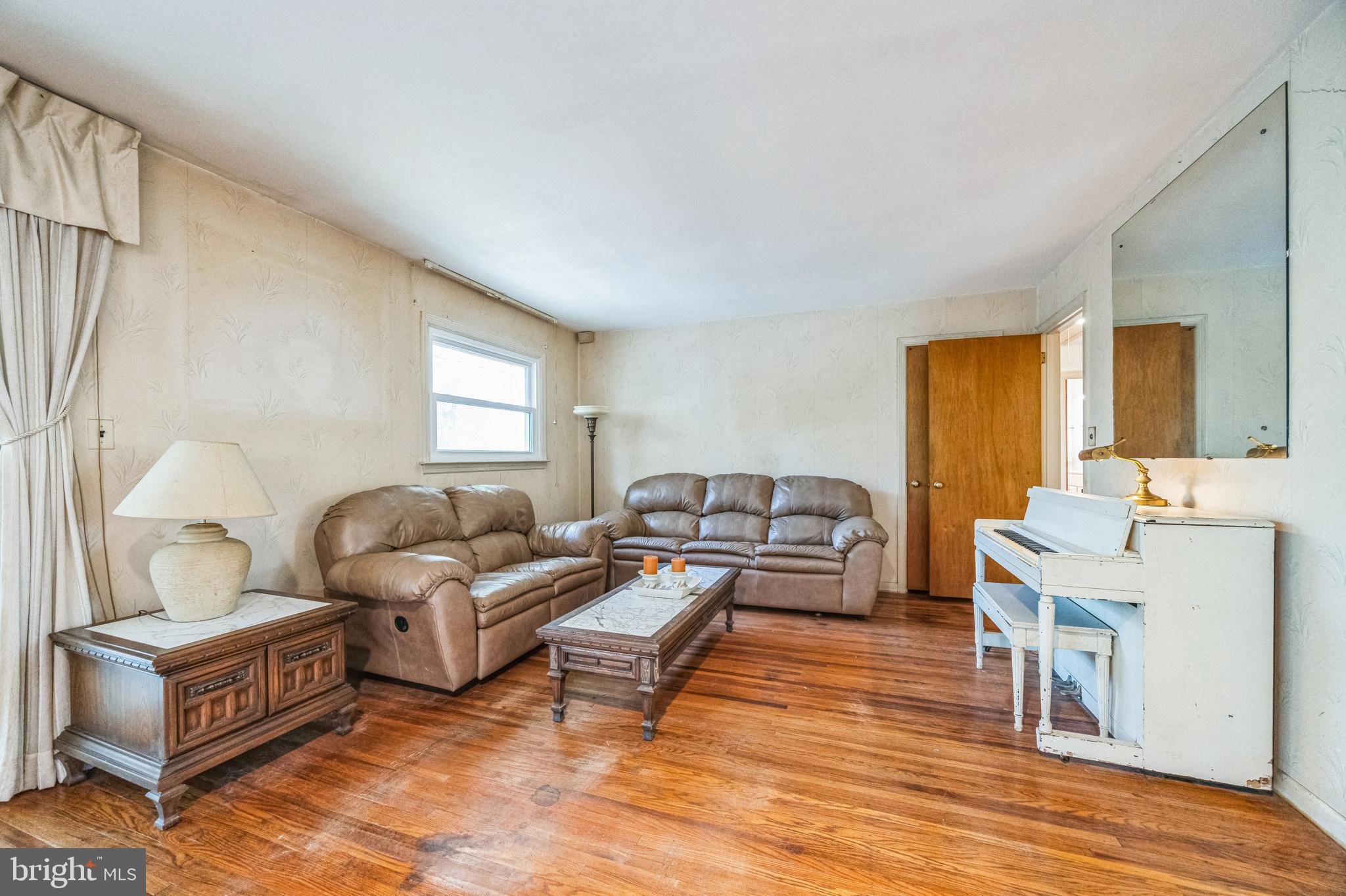 1246 Forge Road Cherry Hill, NJ 08034 - Photo 19 of 34 a living room with furniture and a large window