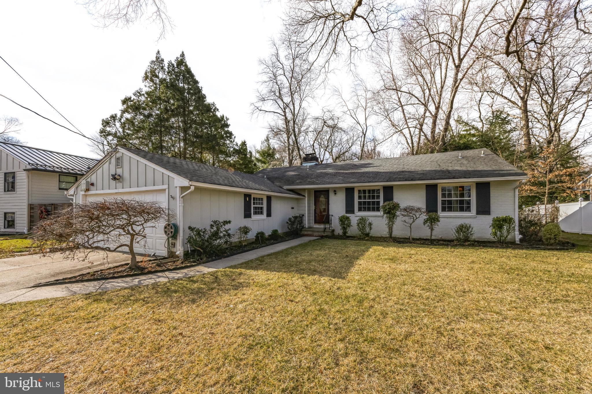 1246 Forge Road Cherry Hill, NJ 08034 - Photo 2 of 34 a front view of a house with a yard