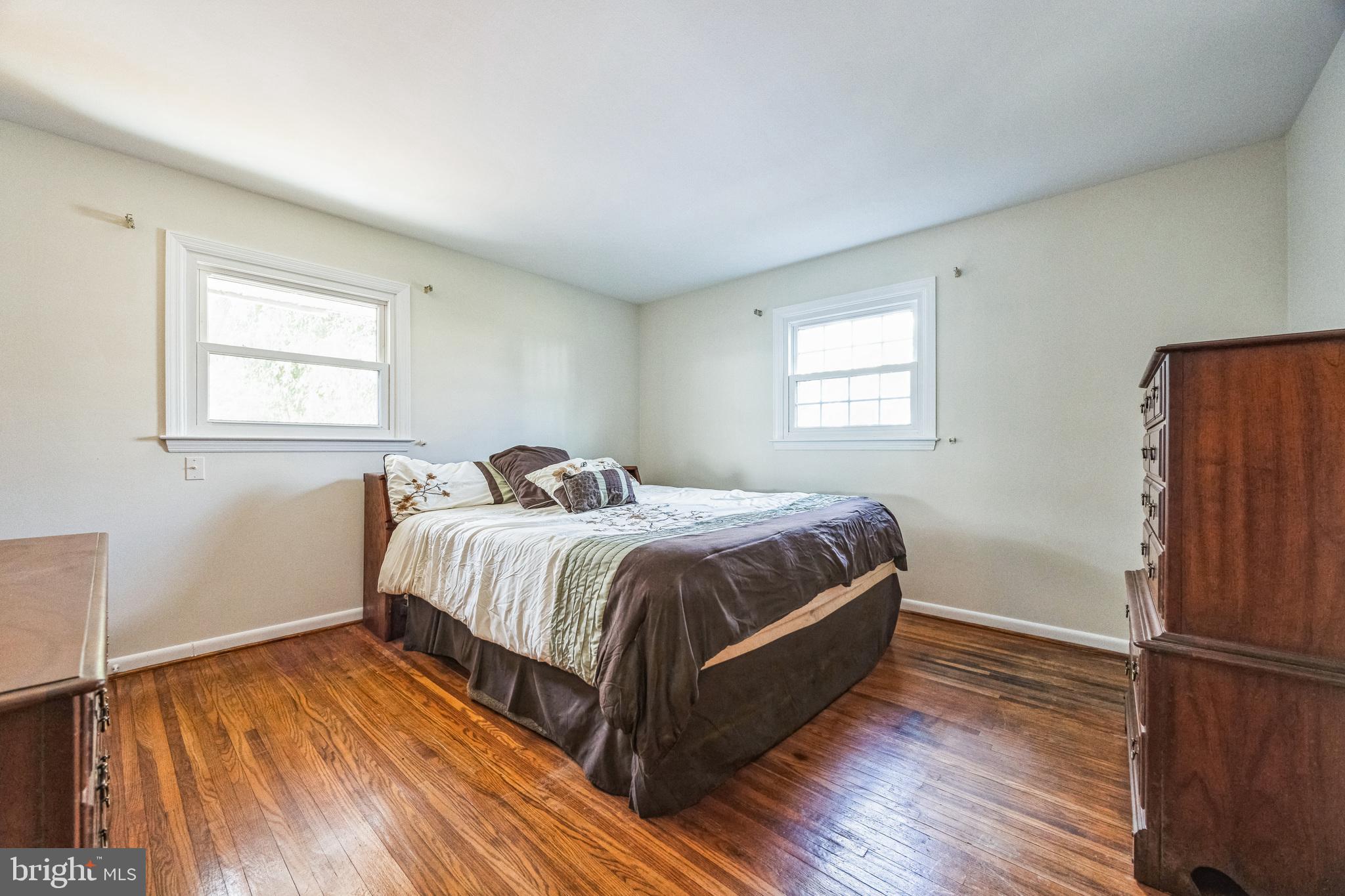 1246 Forge Road Cherry Hill, NJ 08034 - Photo 23 of 34 a bedroom with a bed and wooden floor