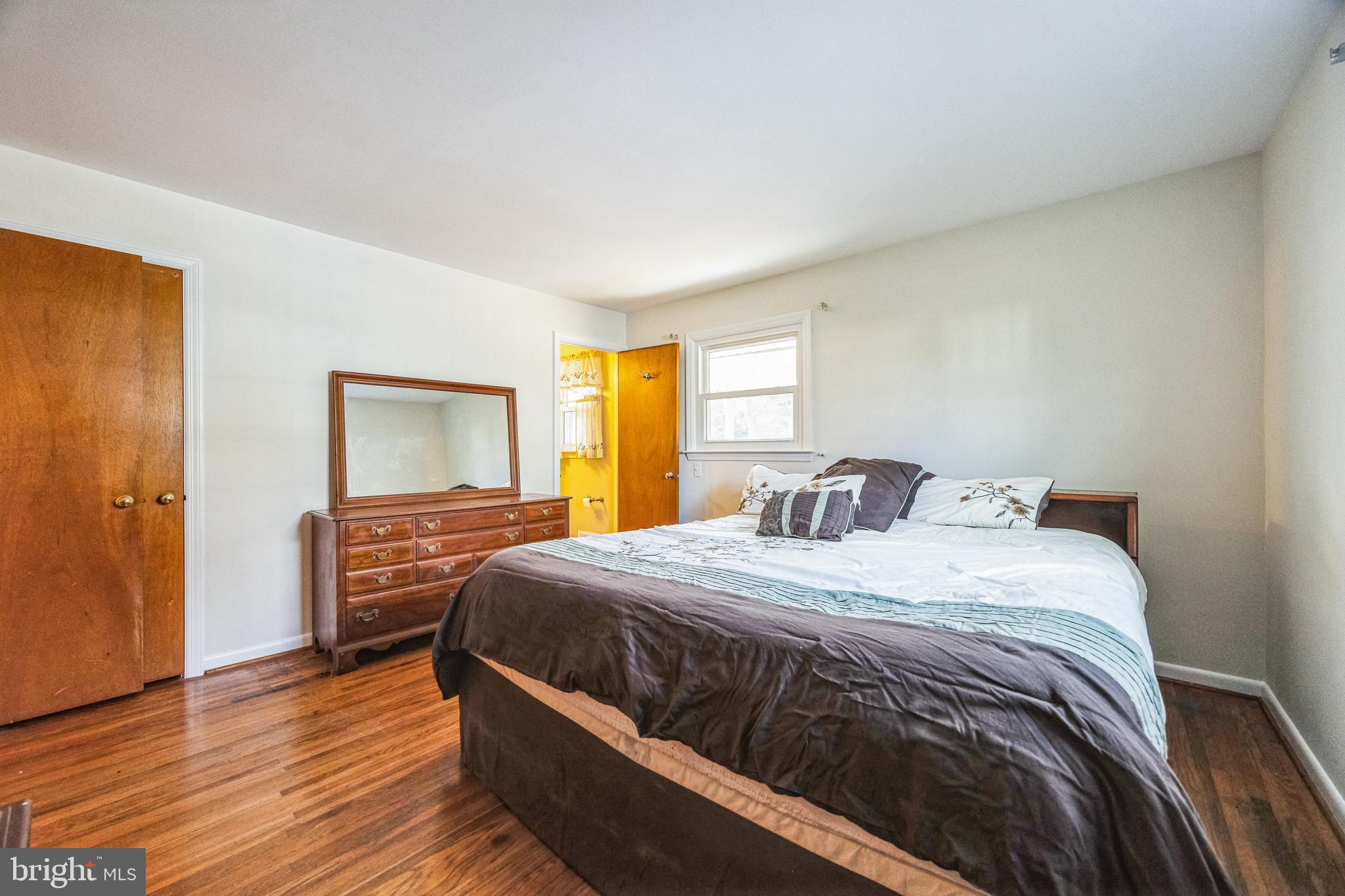 1246 Forge Road Cherry Hill, NJ 08034 - Photo 25 of 34 a bedroom with a bed and wooden floor