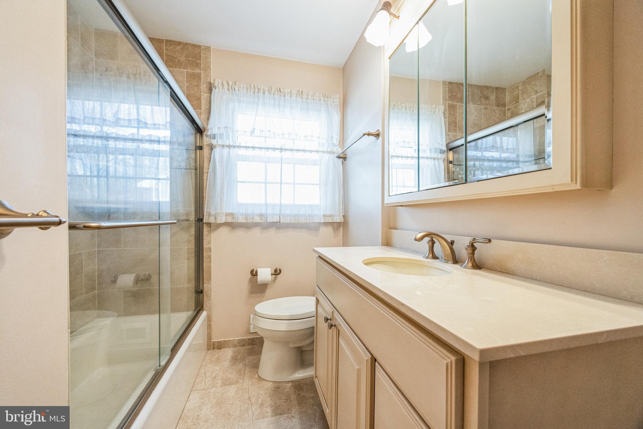 1246 Forge Road Cherry Hill, NJ 08034 - Photo 27 of 34 a bathroom with a sink toilet and shower