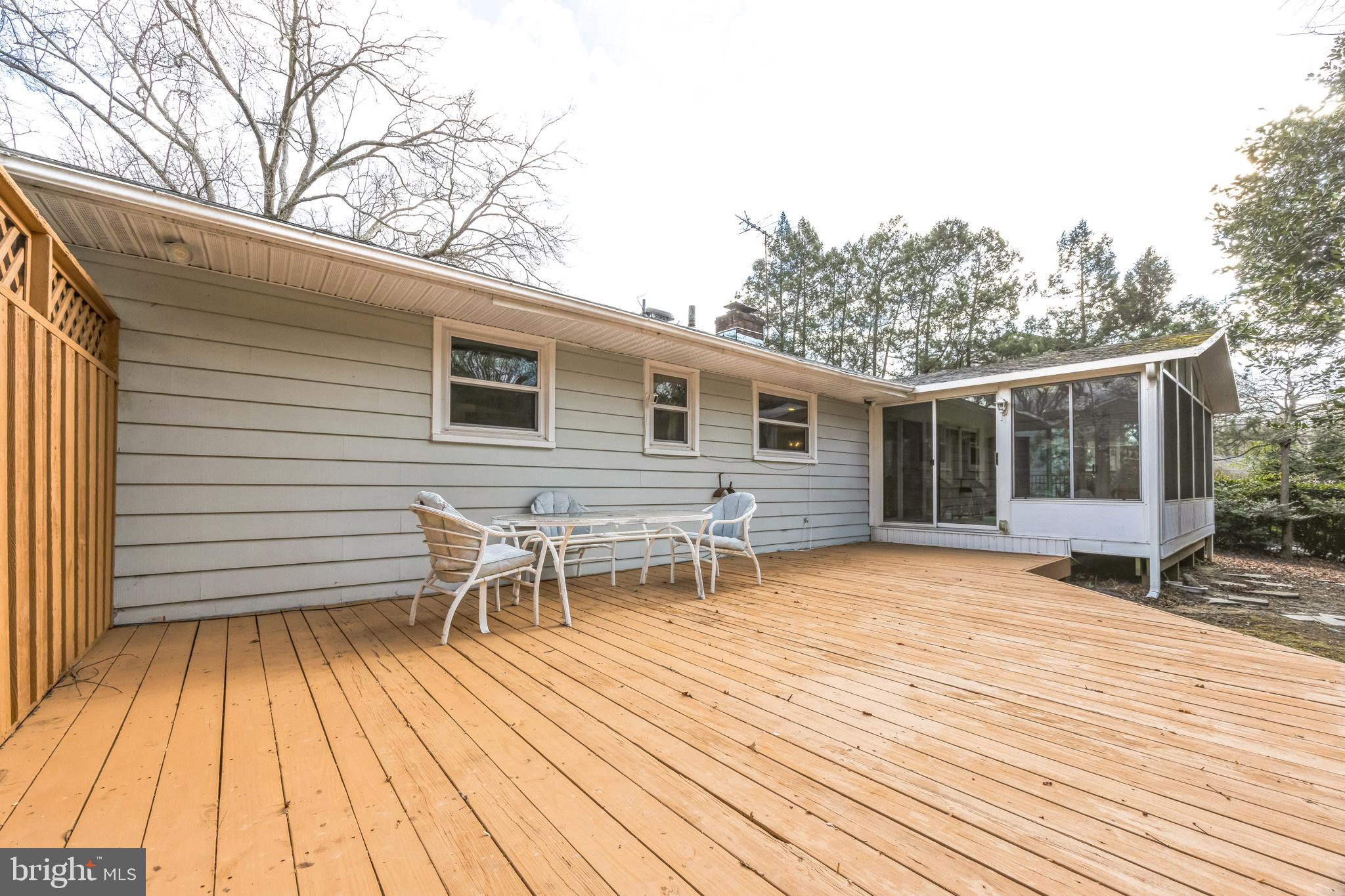 1246 Forge Road Cherry Hill, NJ 08034 - Photo 31 of 34 a backyard of a house with wooden floor outdoor seating and yard in the back