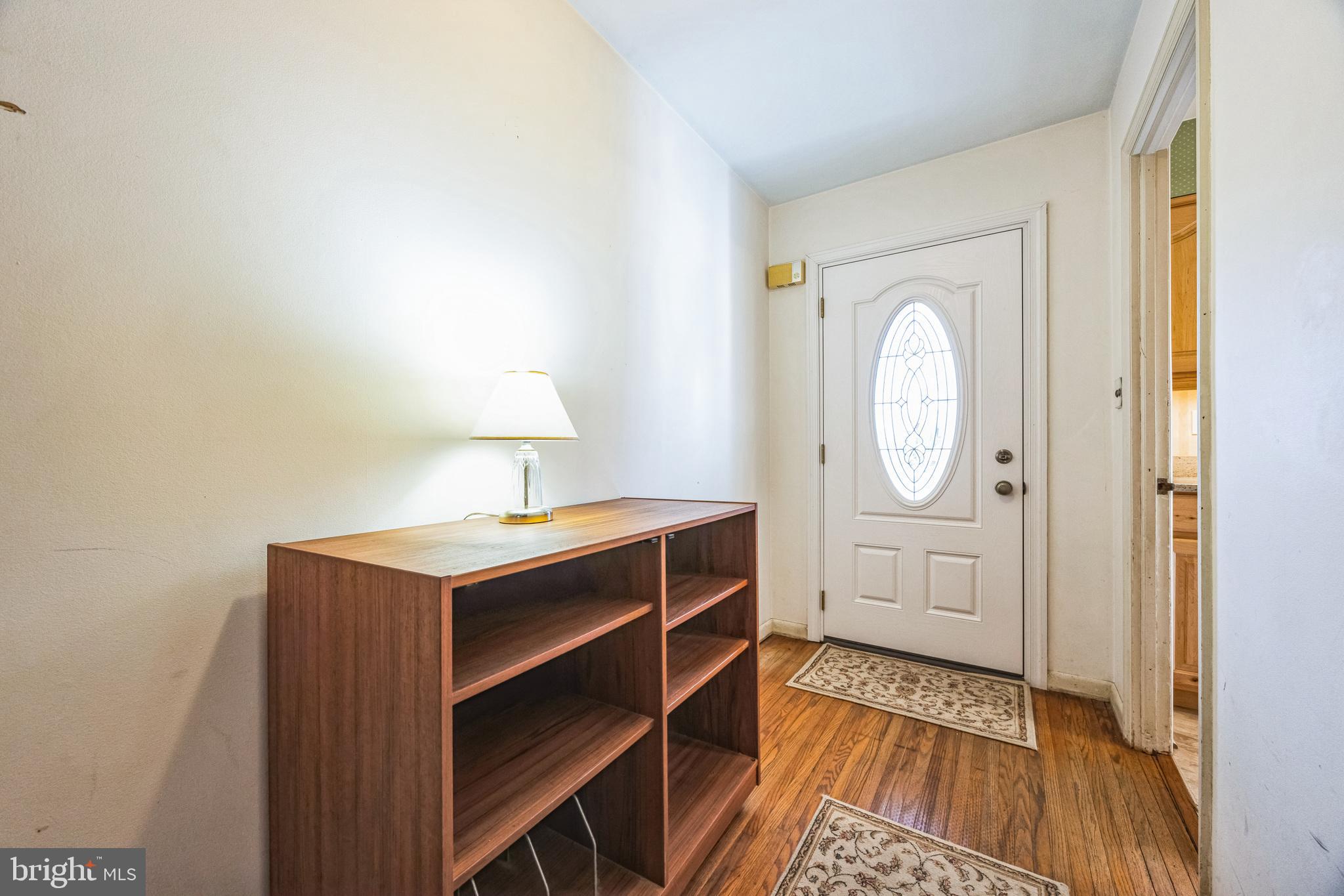 1246 Forge Road Cherry Hill, NJ 08034 - Photo 5 of 34 a view of a hallway with wooden floor and door
