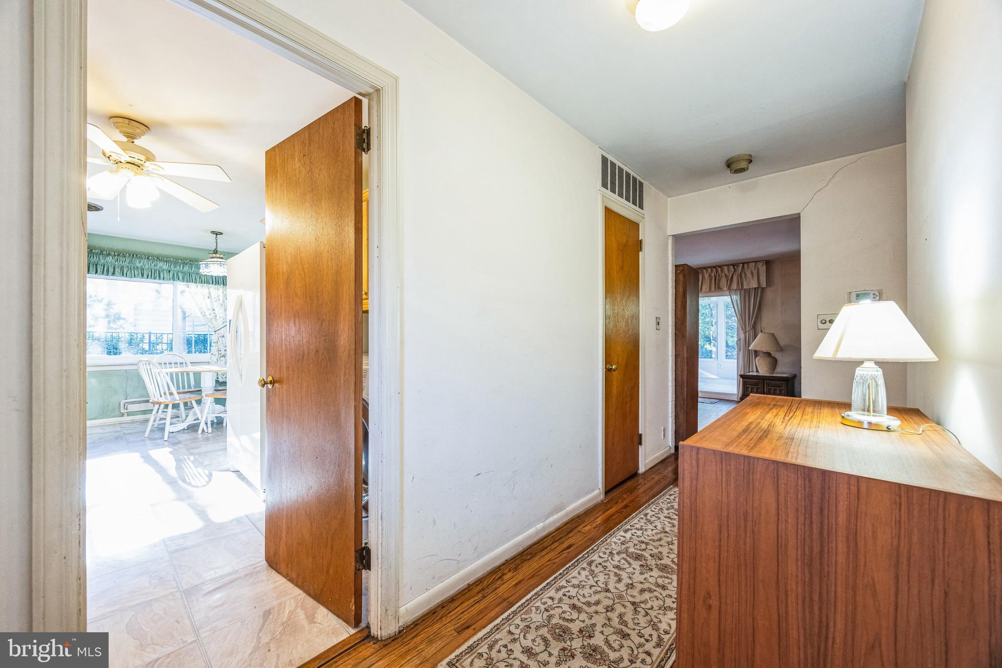 1246 Forge Road Cherry Hill, NJ 08034 - Photo 6 of 34 a hallway with furniture and a chandelier