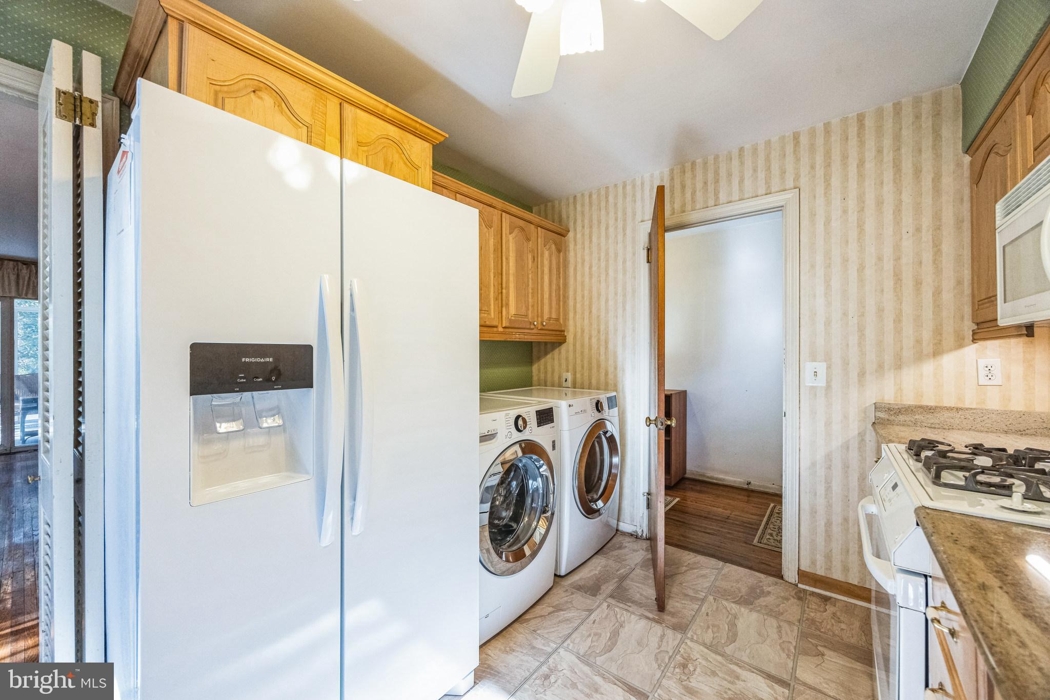 1246 Forge Road Cherry Hill, NJ 08034 - Photo 7 of 34 a view of a hallway with washer and dryer