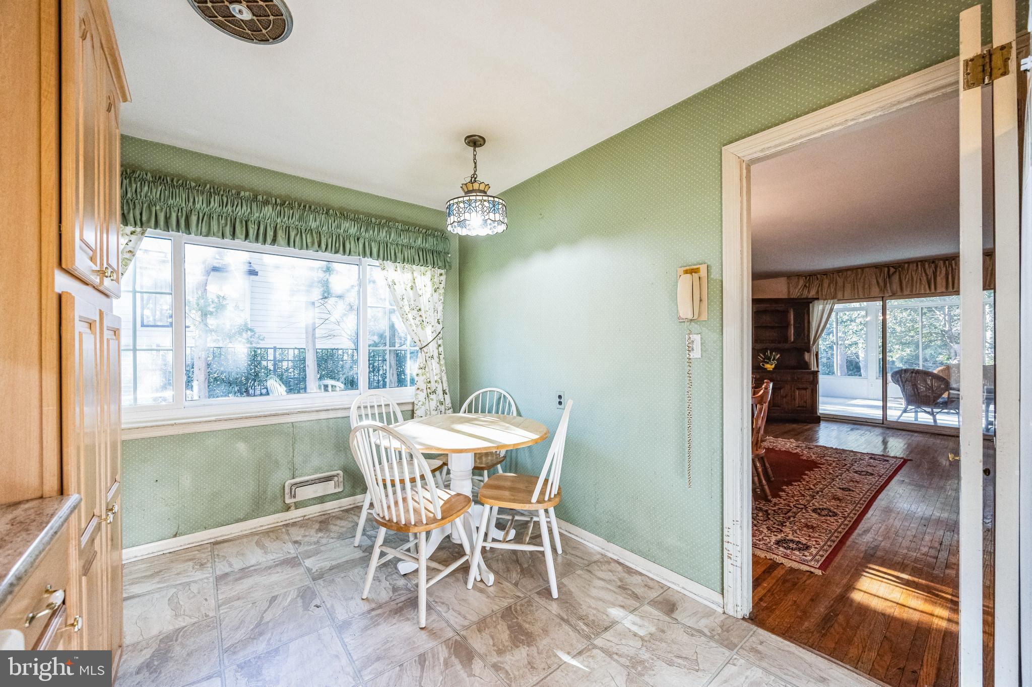 1246 Forge Road Cherry Hill, NJ 08034 - Photo 10 of 34 a dining room with furniture a chandelier and wooden floor