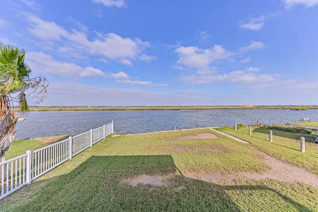 a view of a swimming pool with an ocean view
