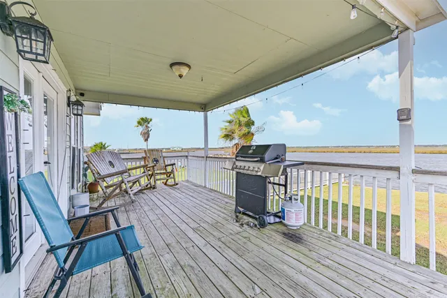 a view of a chairs and table in the balcony
