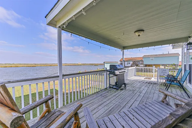 a view of a balcony with chairs