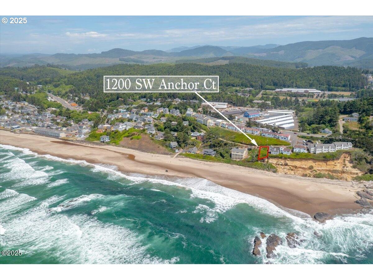 1200 Southwest Anchor Court Lincoln City, OR 97367 - Photo 3 of 15 a view of a street with a building in the background