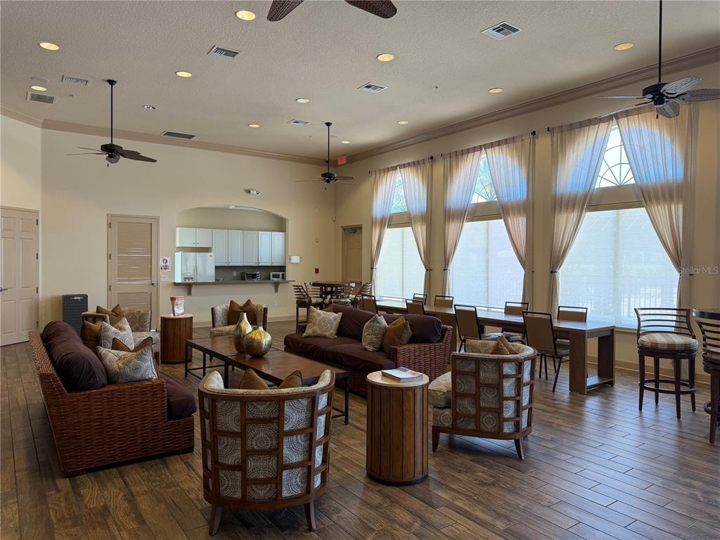 4573 Ada Lane Kissimmee, FL 34746 - Photo 33 of 37 a living room with lots of furniture and a large window