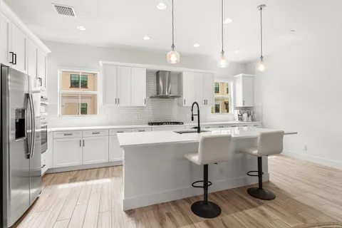 a view of a balcony with lake view and a potted plant