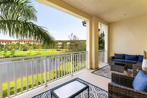 a bedroom with a bed and a flat tv screen on dresser