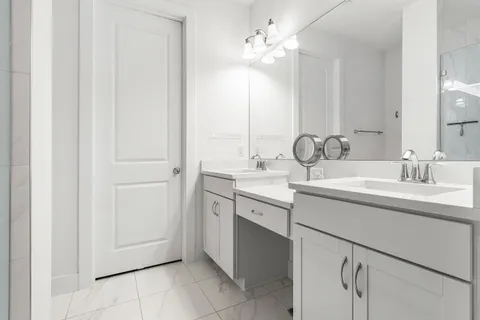 a bedroom with a bed a desk and chair