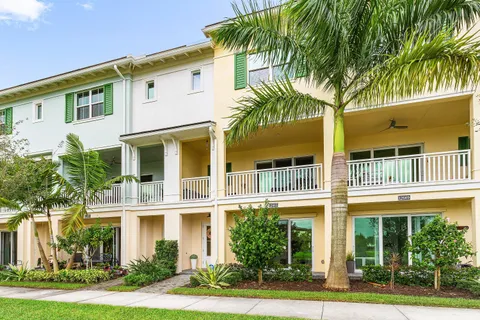 an aerial view of multiple houses with yard