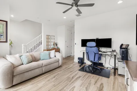 a view of a dining room with furniture window and wooden floor