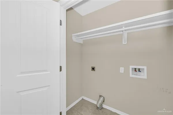 a view of a house with wooden fence