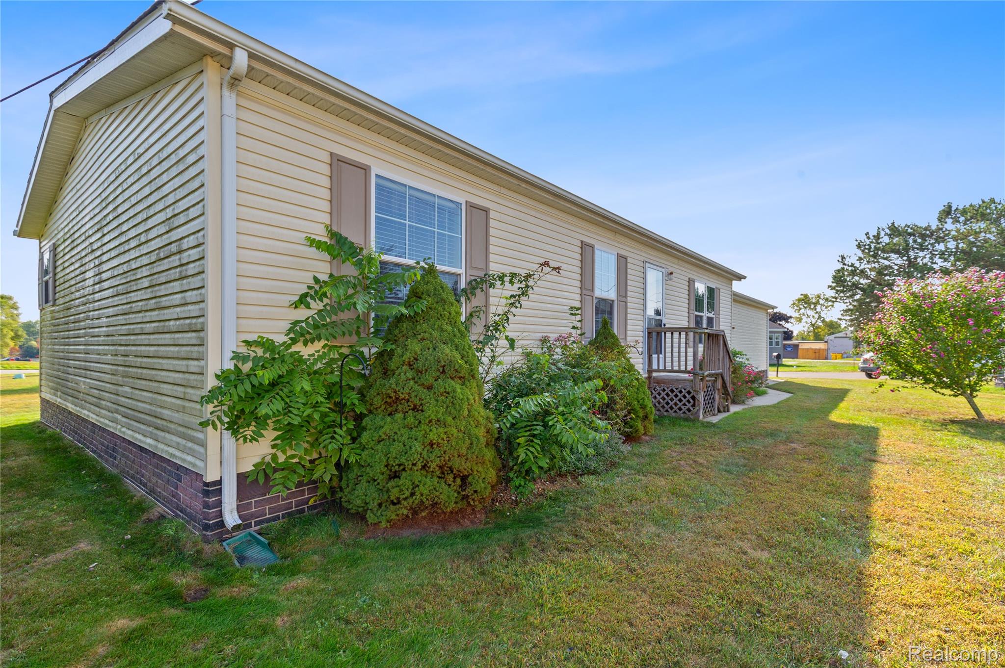 111 Riviera Oxford, MI 48371 - Photo 20 of 22 View of home's exterior with a yard