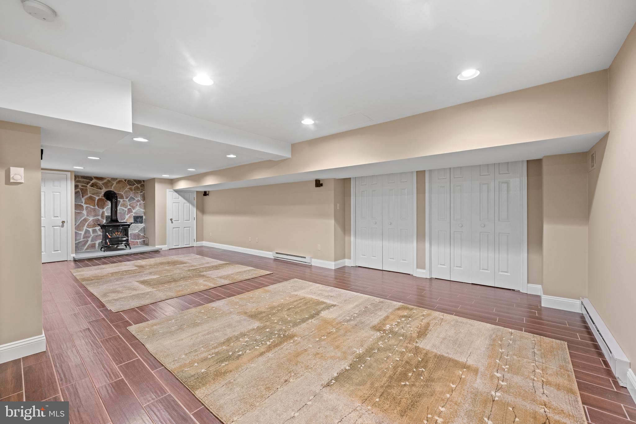 155 Barton Drive Spring City, PA 19475 - Photo 38 of 65 Lower Level finished area w/ woodstove