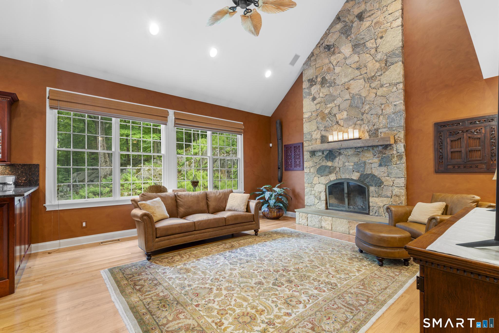 12 Logans Way Danbury, CT 06811 - Photo 9 of 40 a living room with furniture and a fireplace