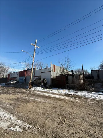 a view of a car park in front of a house