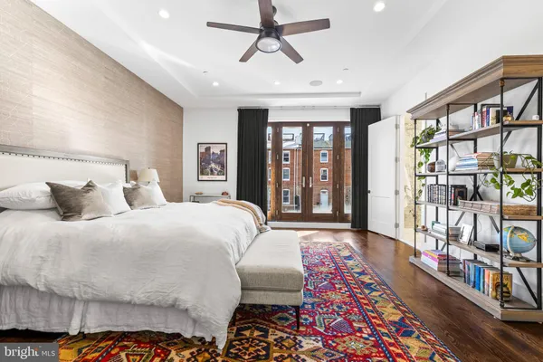 a bed room with a bed and a book shelf