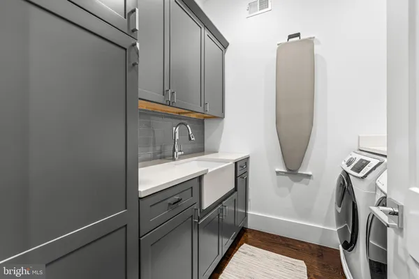 a bathroom with a sink a mirror and vanity