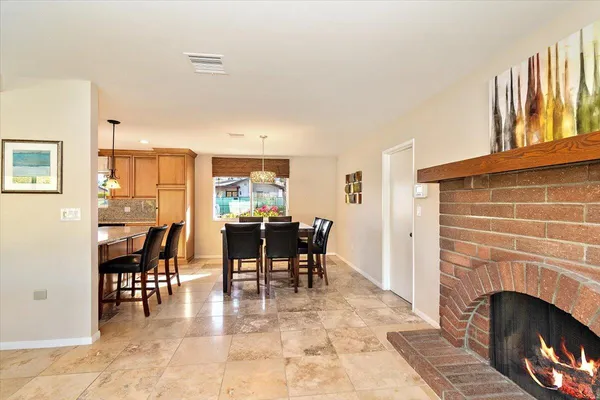 a view of a livingroom with furniture and a fireplace