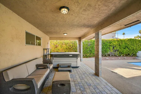 a view of a patio with table and chairs with wooden floor fence and roof