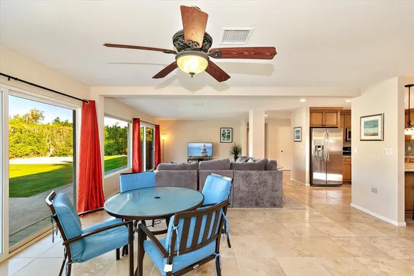 a view of a dining room with furniture window and outside view