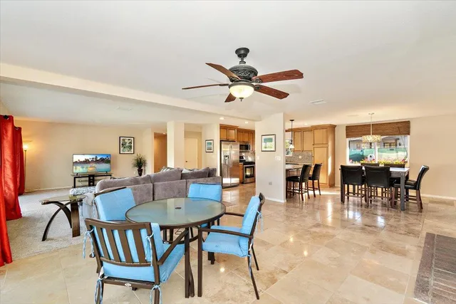a dining room with furniture and window