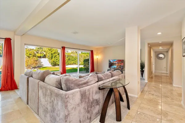 a living room with furniture and a large window