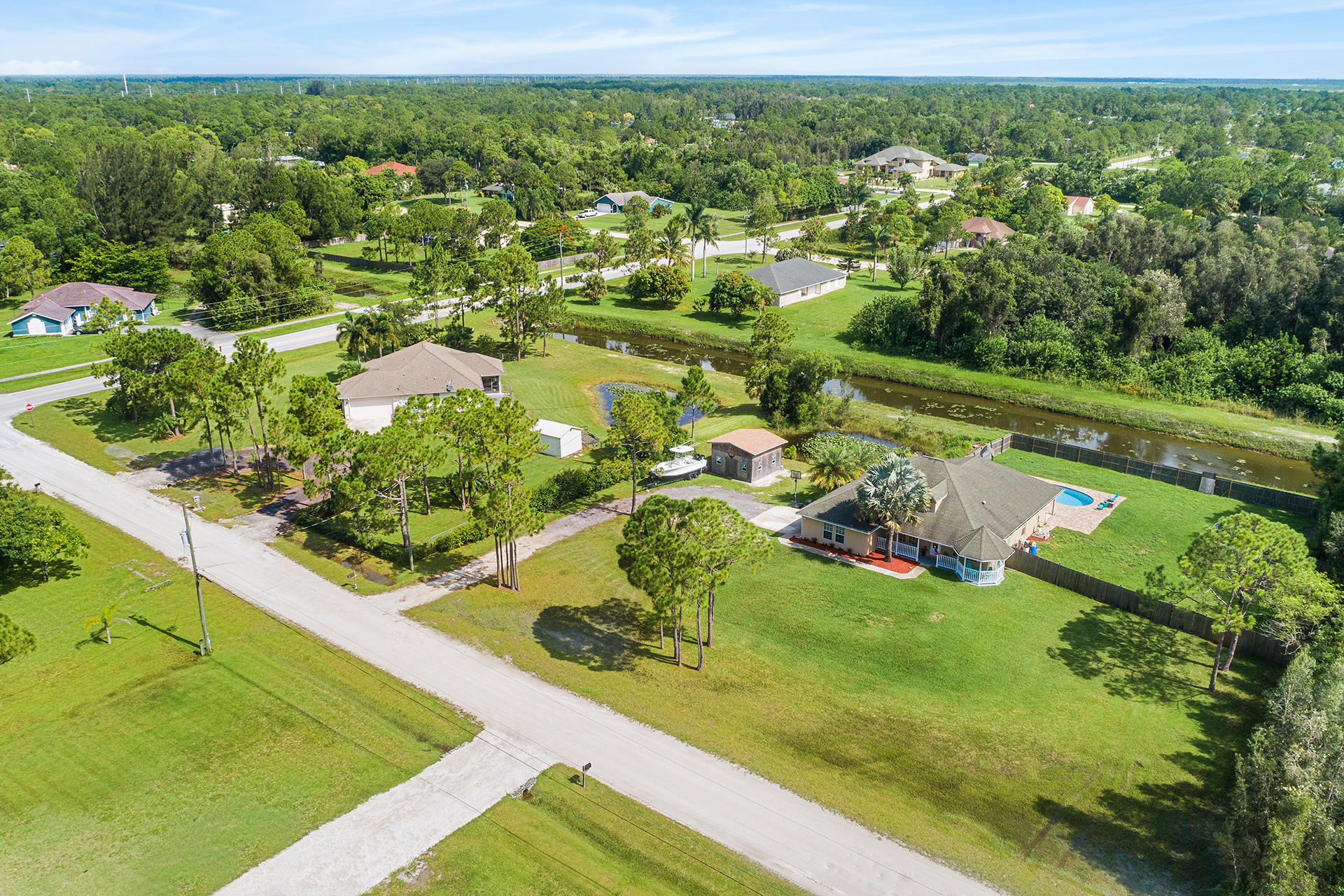 14899 86th Road North Loxahatchee, FL 33470 - Photo 32 of 34 Drone side street