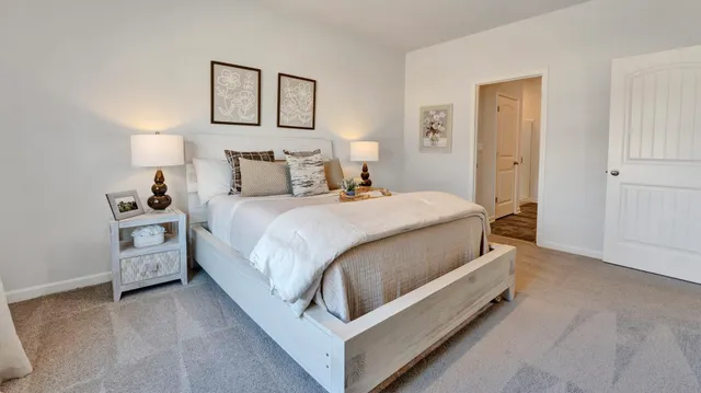 a bed room with a bed and a night stand