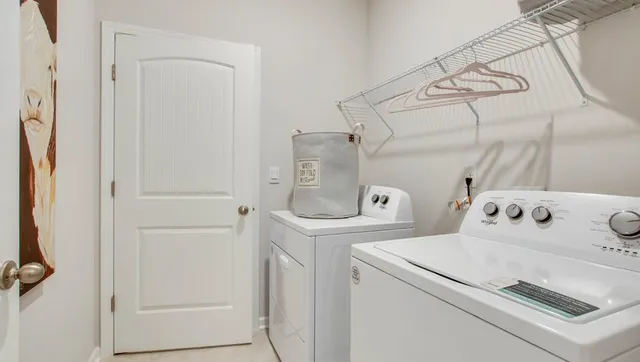a utility room with dryer and washer
