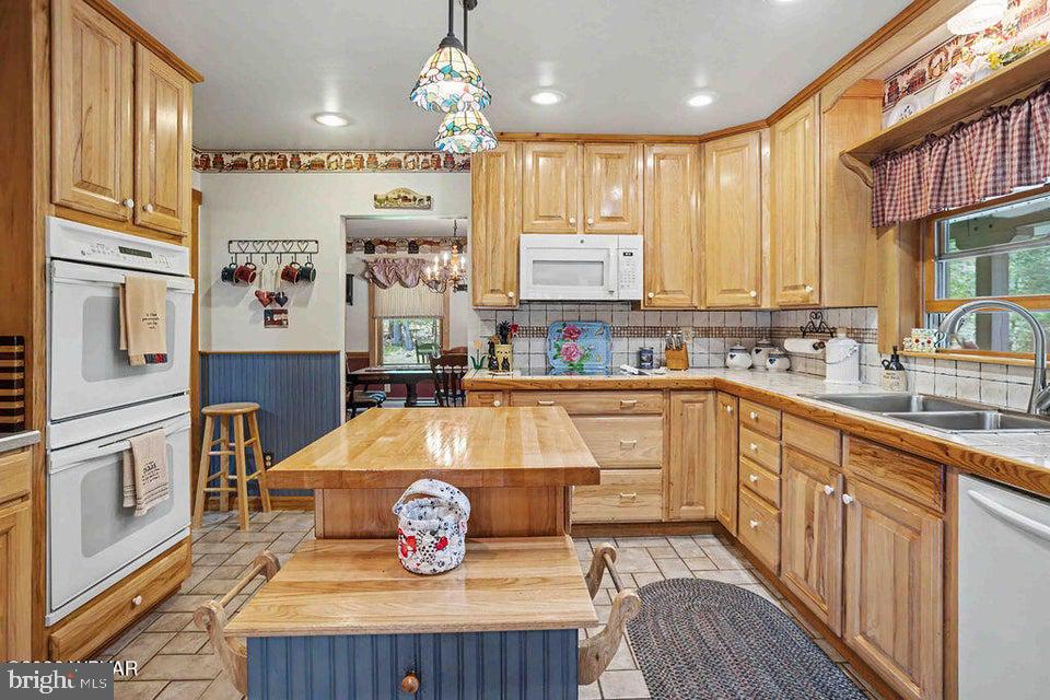 2270 Pine Tree Road Hughesville, PA 17737 - Photo 27 of 90 Charming kitchen with warm wood tones.
