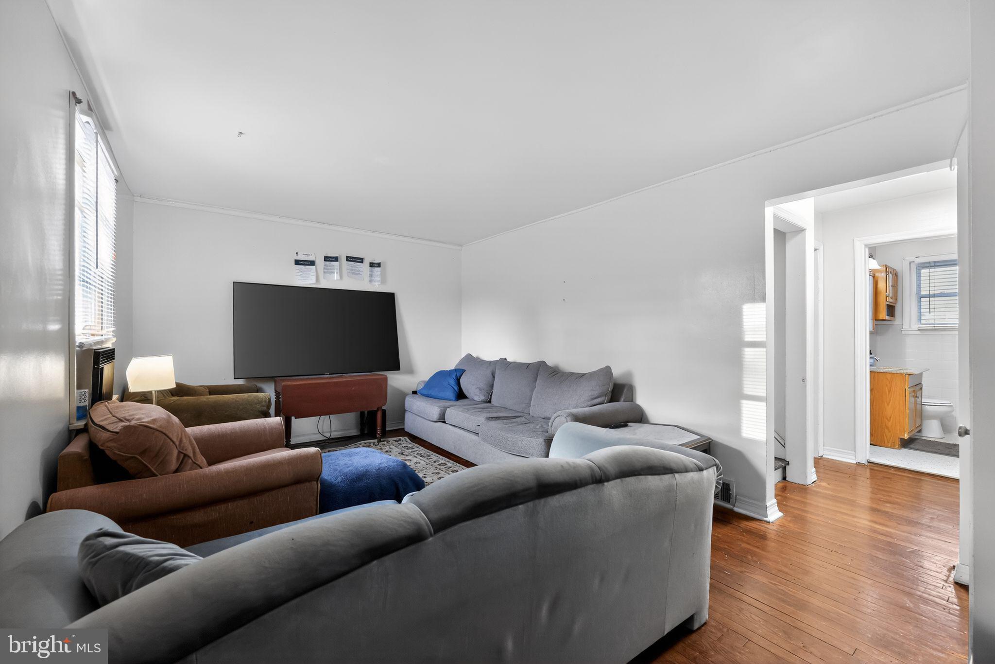 438 Ewingville Road Ewing, NJ 08638 - Photo 21 of 43 a living room with furniture and a flat screen tv