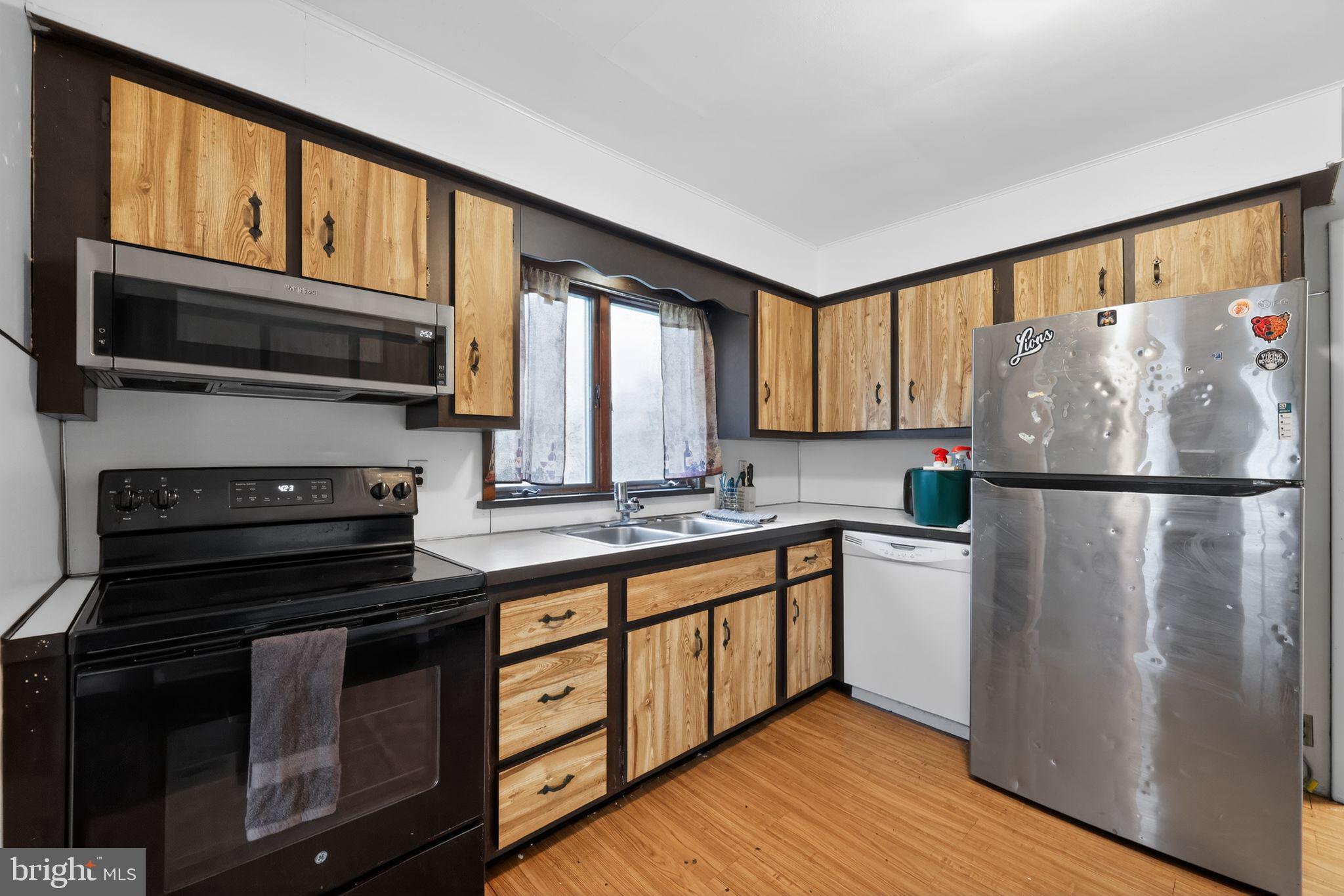 438 Ewingville Road Ewing, NJ 08638 - Photo 24 of 43 a kitchen with stainless steel appliances granite countertop a refrigerator a stove a sink and a microwave