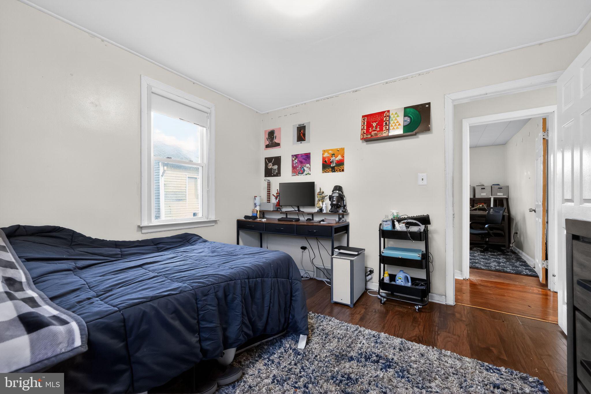 438 Ewingville Road Ewing, NJ 08638 - Photo 30 of 43 a bedroom with a bed and a table in it