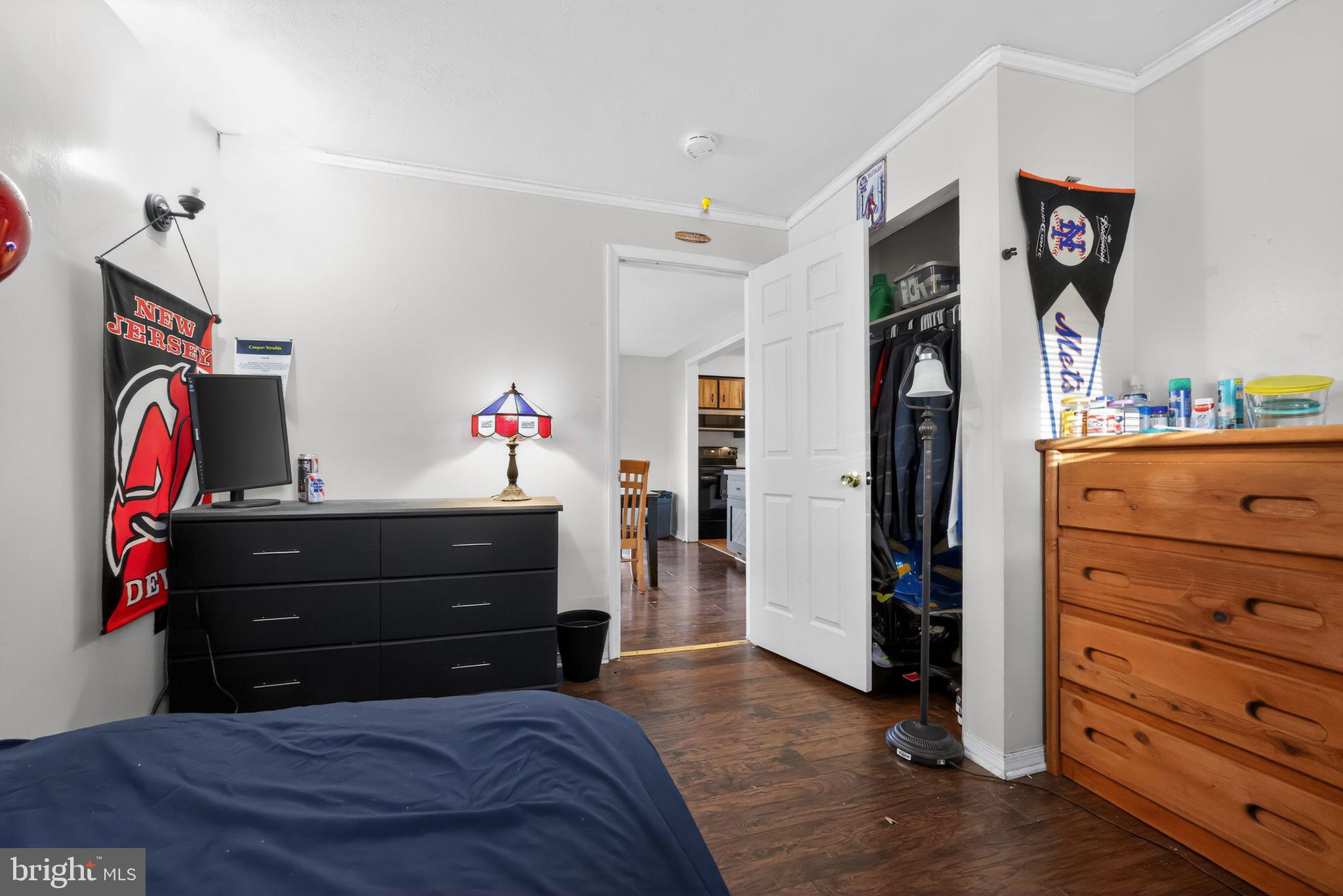 438 Ewingville Road Ewing, NJ 08638 - Photo 31 of 43 a bedroom with a bed and a dresser