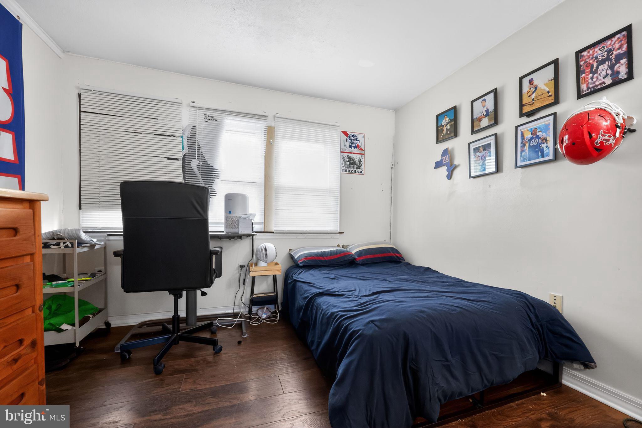 438 Ewingville Road Ewing, NJ 08638 - Photo 32 of 43 a bedroom with a bed and a window