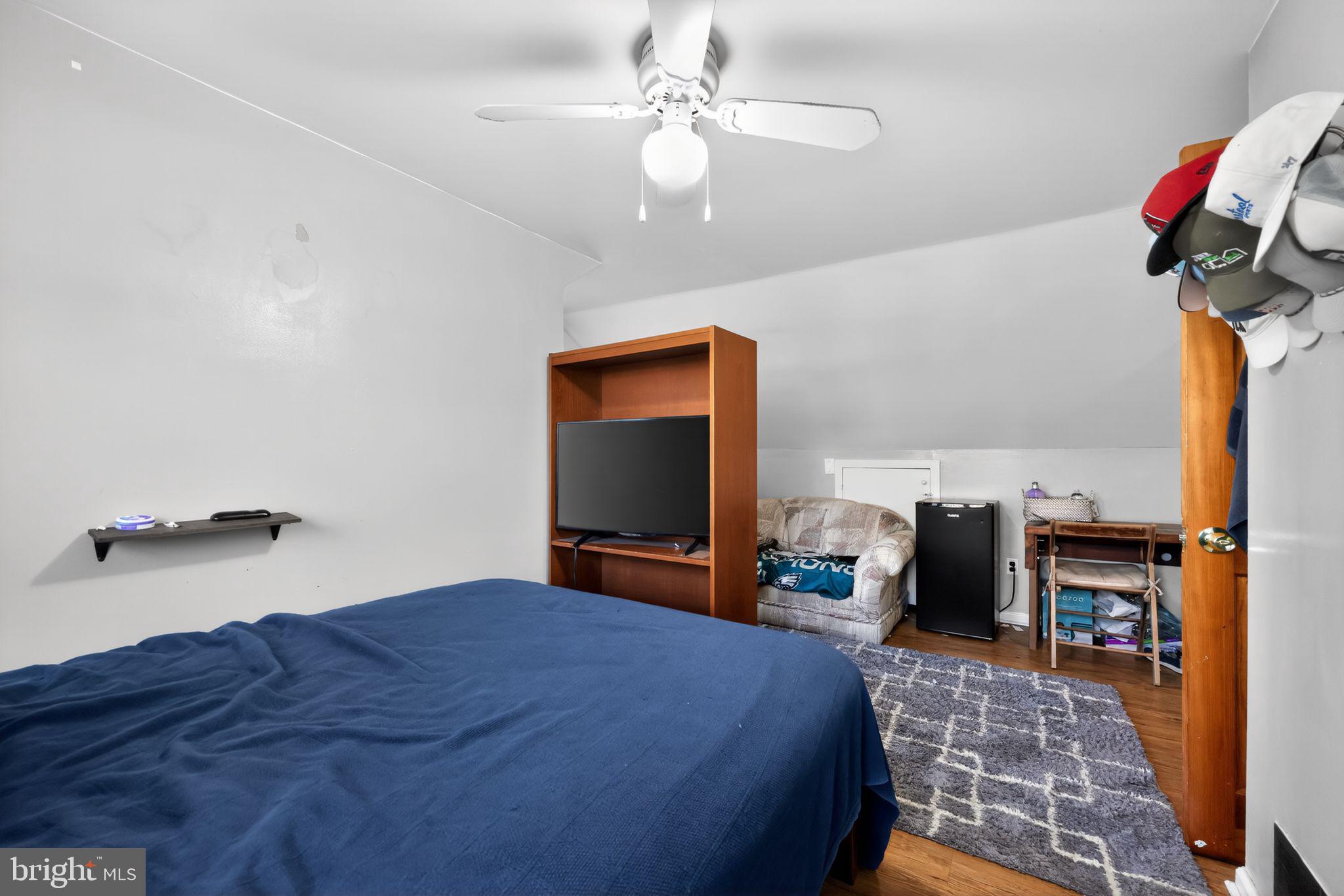 438 Ewingville Road Ewing, NJ 08638 - Photo 34 of 43 a bedroom with bed and a chandelier