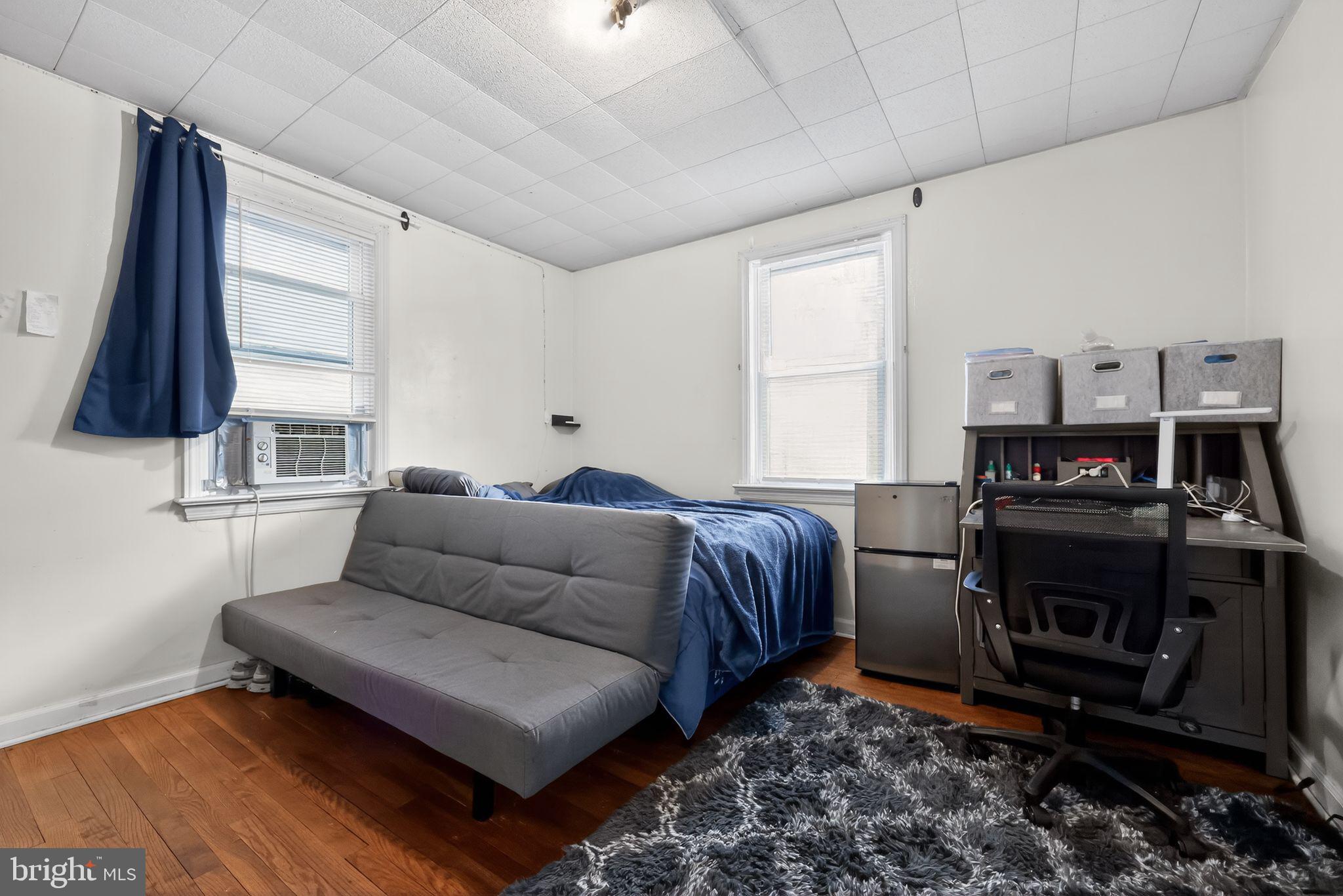 438 Ewingville Road Ewing, NJ 08638 - Photo 35 of 43 a living room with a couch and a flat screen tv