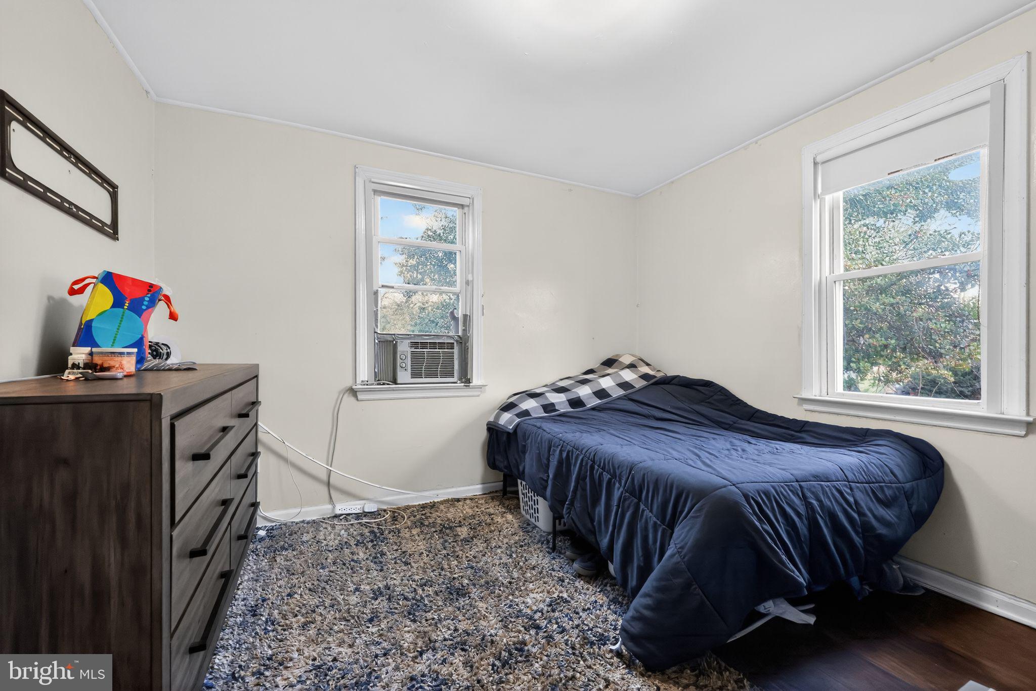 438 Ewingville Road Ewing, NJ 08638 - Photo 36 of 43 a bedroom with a bed and a window