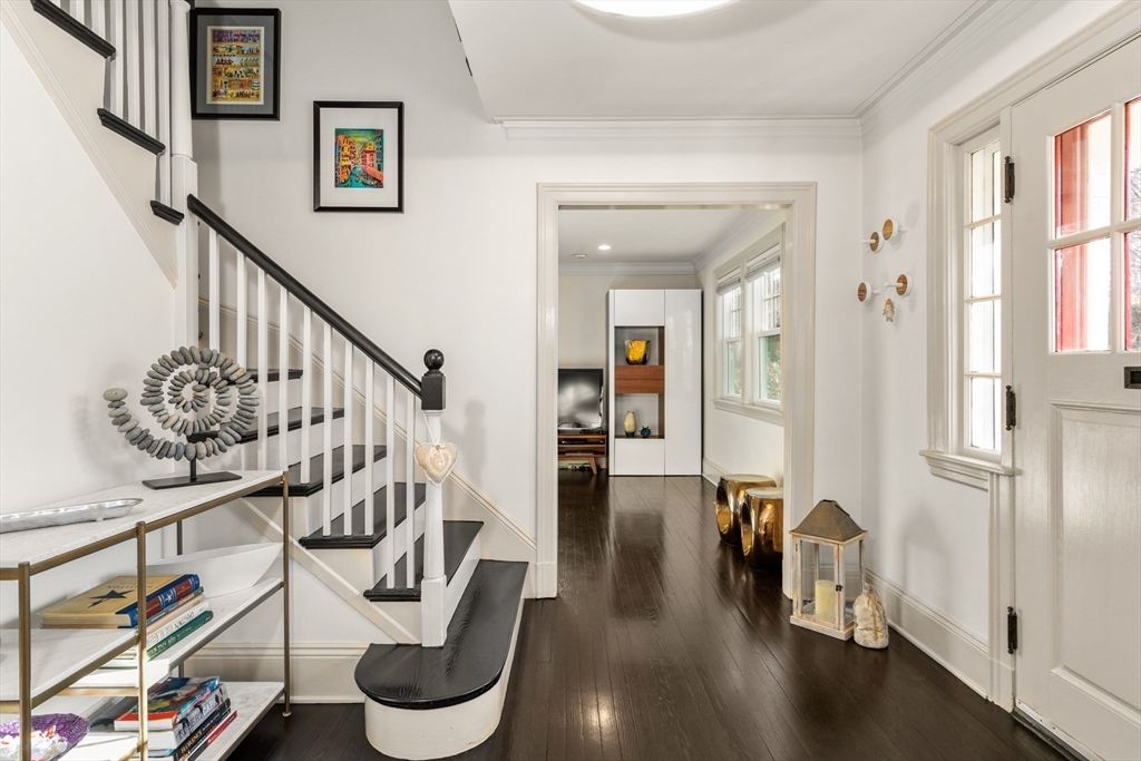 48 Stone Road Belmont, MA 02478 - Photo 3 of 41 a hallway with wooden floor and furniture