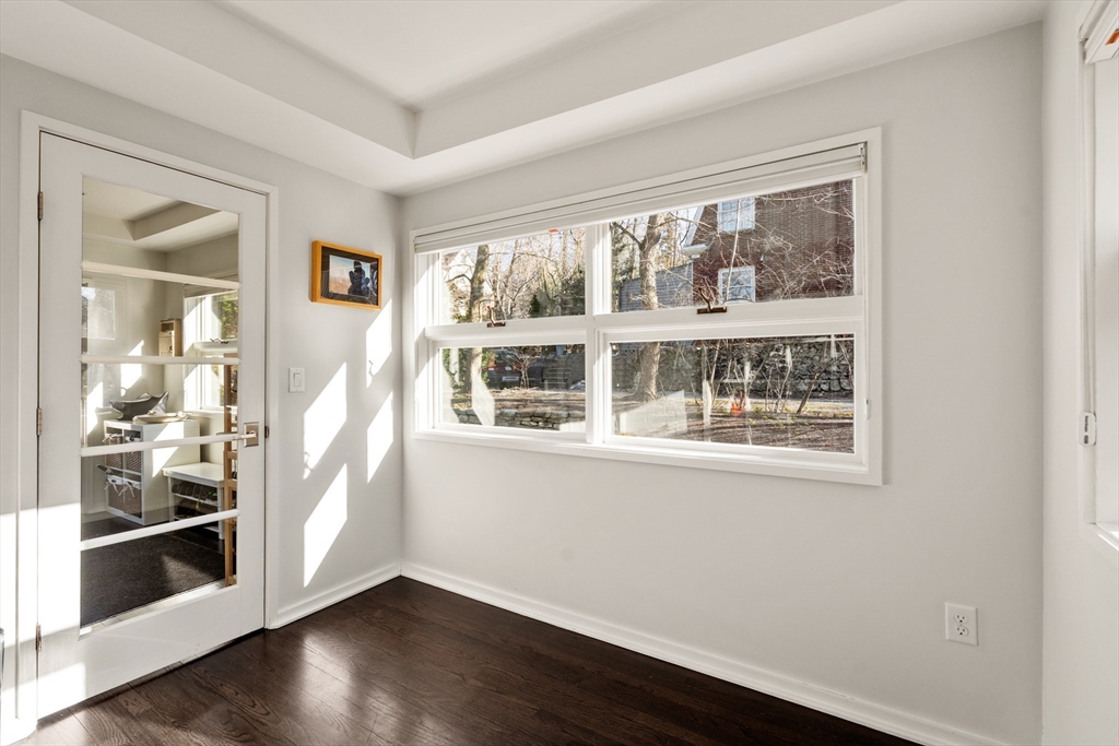 48 Stone Road Belmont, MA 02478 - Photo 7 of 41 a view of an empty room with wooden floor and a window