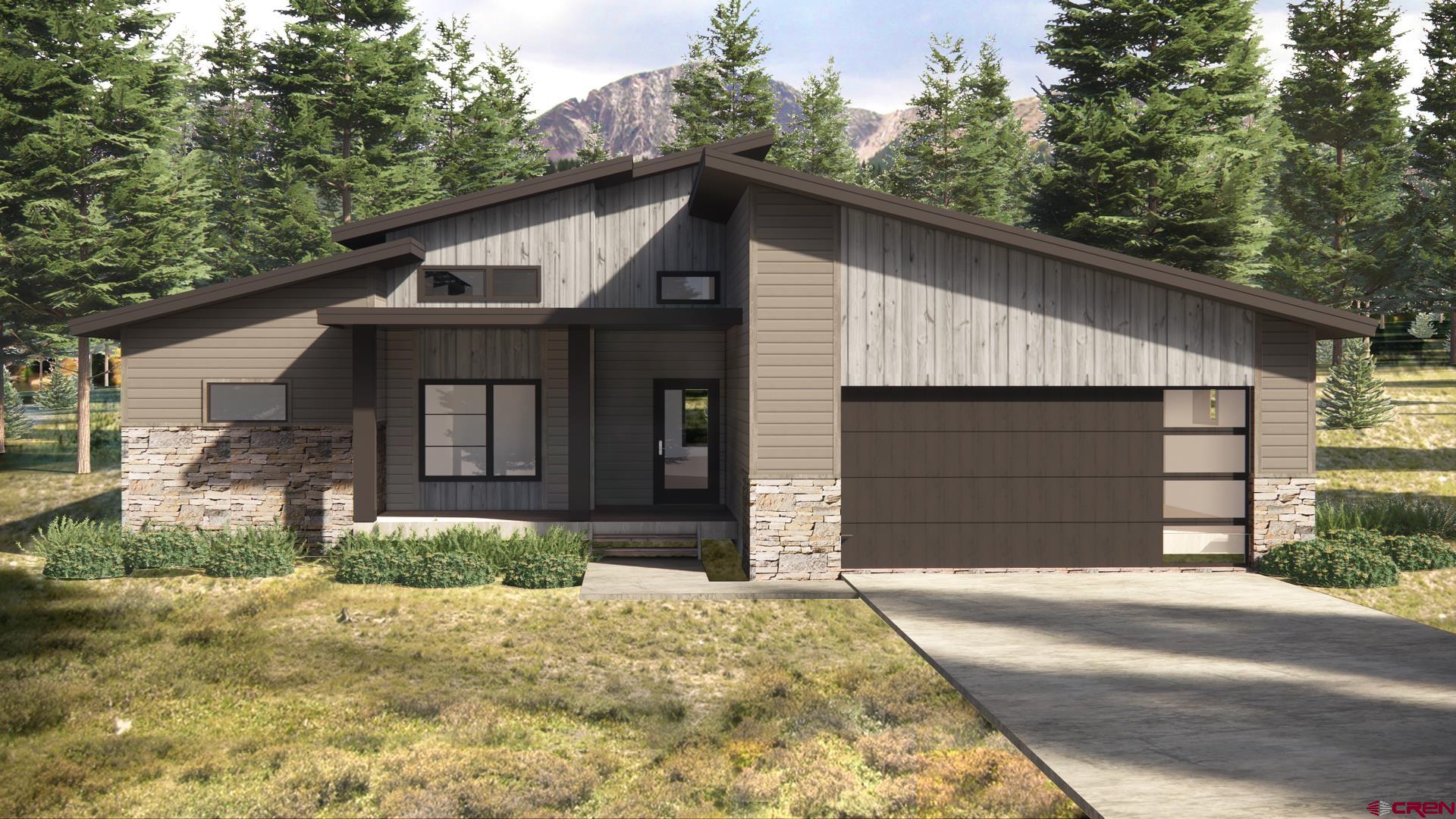 132 Edgemont Meadows Road Durango, CO 81301 - Photo 2 of 7 a front view of a house with a yard and garage