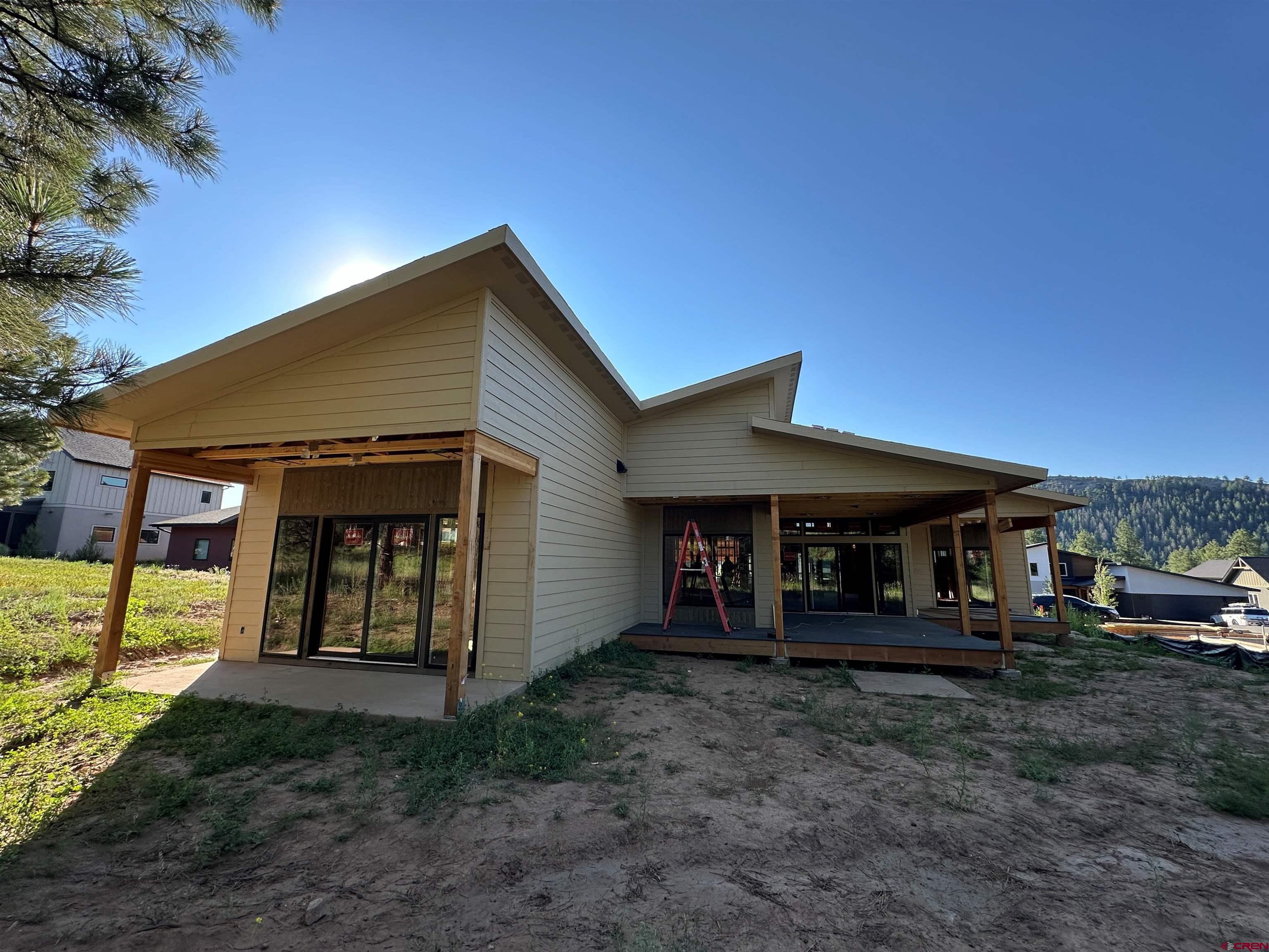 132 Edgemont Meadows Road Durango, CO 81301 - Photo 4 of 7 a front view of a house with garden