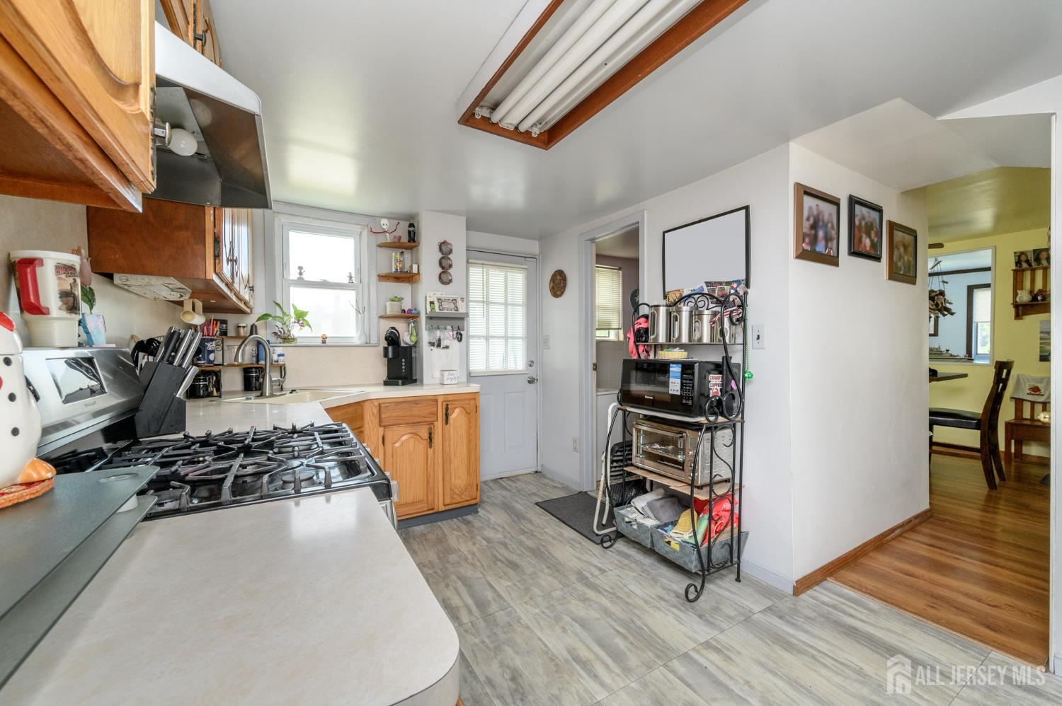 1650 Holly Road North Brunswick, NJ 08902 - Photo 12 of 41 a kitchen with stainless steel appliances granite countertop a stove and a refrigerator